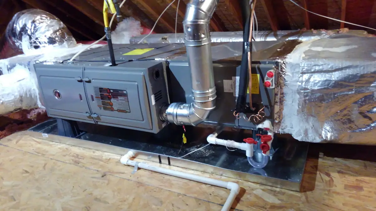 Air handler installed in an attic with new drain and float switch