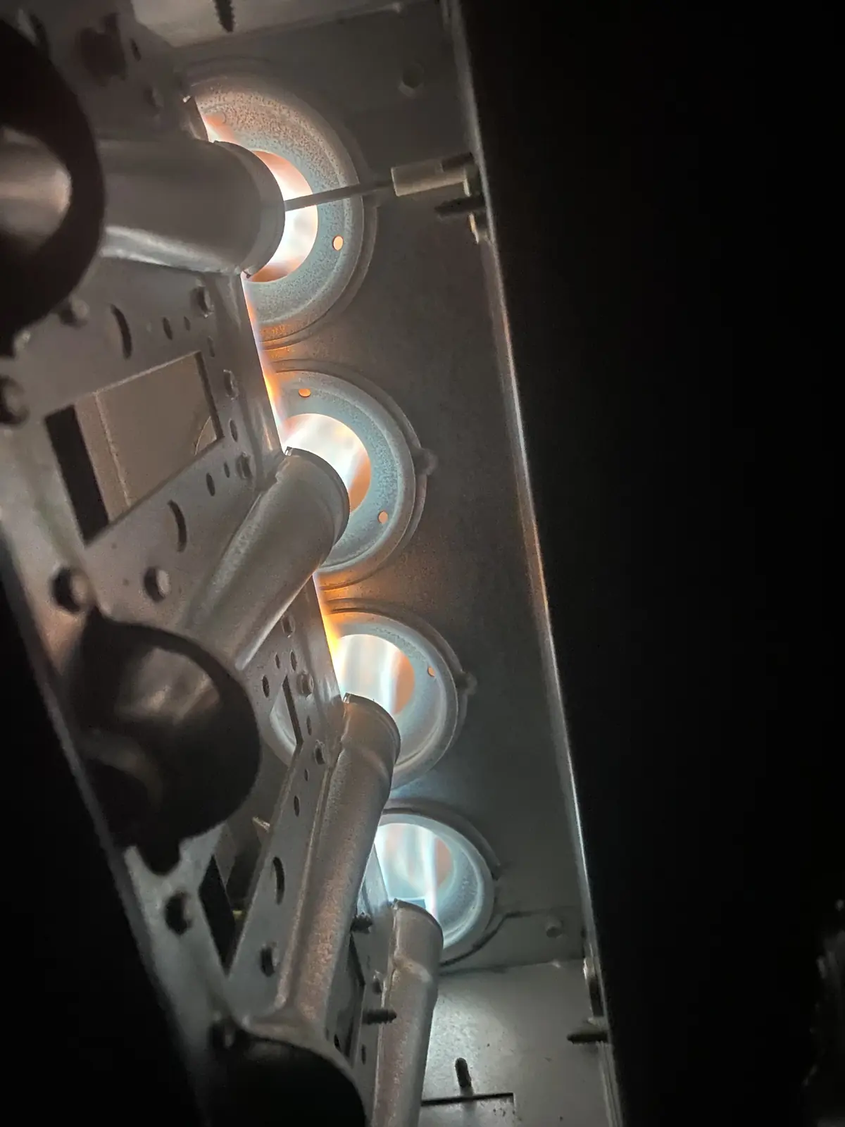Furnace burners firing during an Ace Mechanical heating repair