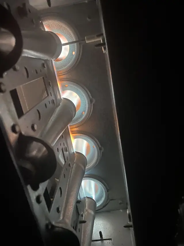 Furnace burners firing during a heating repair