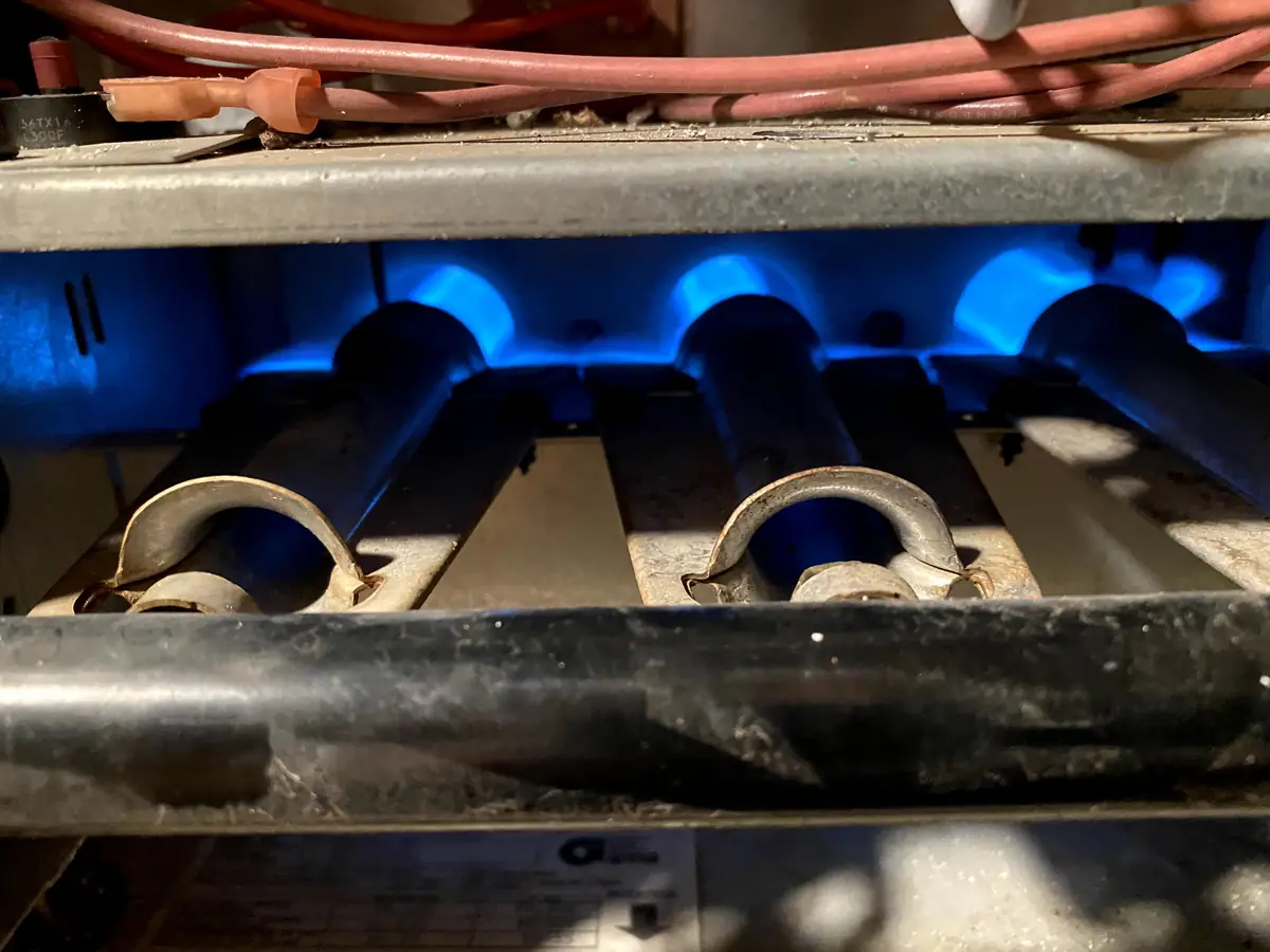 Gas burners firing during a boiler and heating service