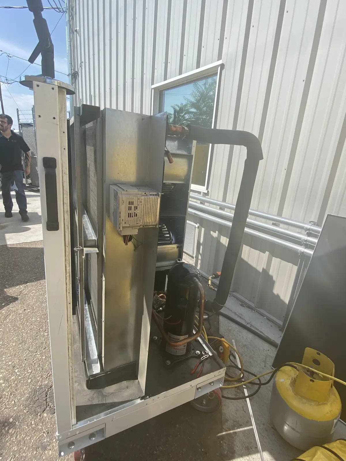 Ace technician recovering refrigerant during an AC repair